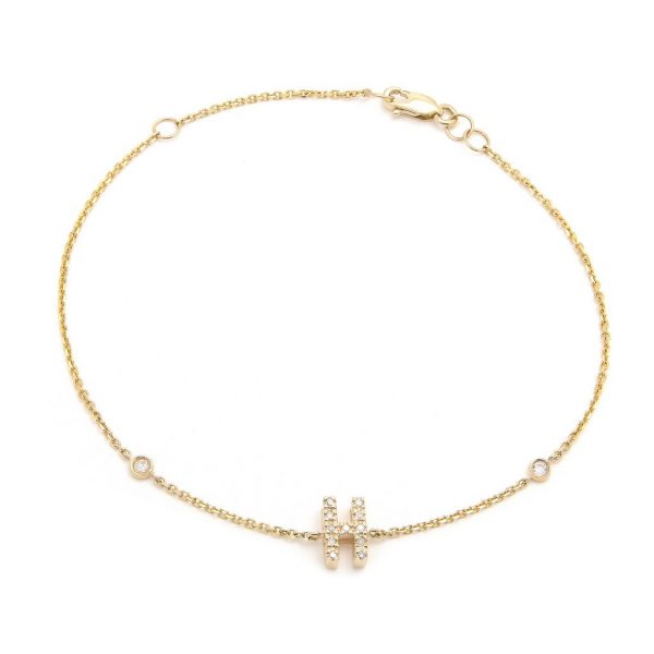 Pulsera con dijes de letras en oro de 14 quilates con diamantes: AZ